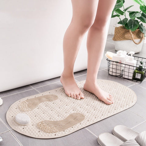 Standing on beige anti-slip shower mat with foot zones