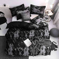 Decorative pillows and duvet on queen bed with modern decor