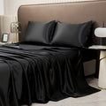 Black satin twin bedding set with silky pillowcases and colorful sheets style for a luxurious hotel-inspired bedroom.