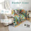 Bohemian floral cotton throw blanket showing two available sizes 60"x80" and 80"x90" draped over beige sofa in bright living room