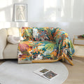 Bohemian tropical floral cotton throw blanket draped over beige sofa in cozy living room with natural light and modern decor