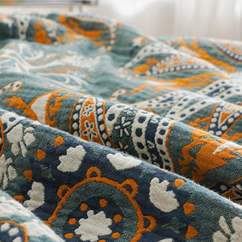 Artisanal boho cotton quilt with teal and burnt orange pattern

