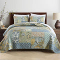 Bohemian floral cotton quilt set styled on wooden bed with white pillows