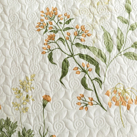 Soft cotton quilt with botanical floral print and quilted detail