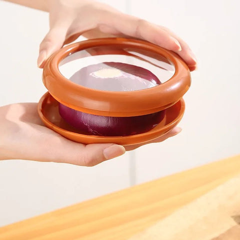 Person sealing onion in BPA-free food pod