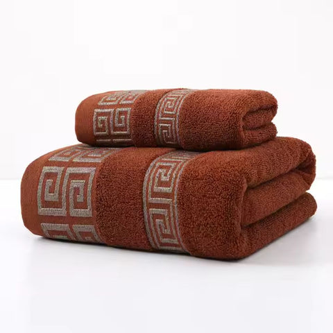 Brown towel set folded with silver Greek border