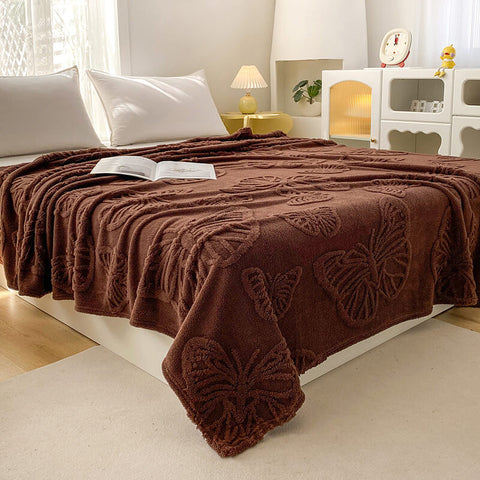 Brown butterfly fleece blanket styled as lightweight bed cover for all seasons