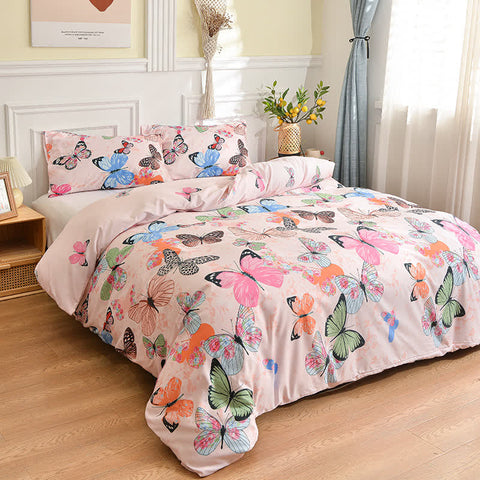 Butterfly pink duvet cover on bed with soft pastel bedroom decor