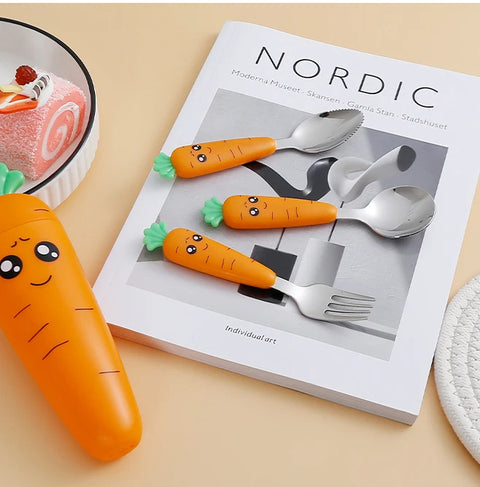 Playful kids carrot cutlery laid on book and table