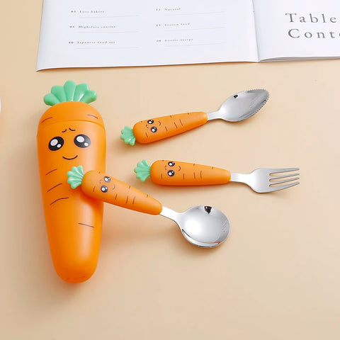 Flat lay of carrot-themed spoon fork and case for toddlers