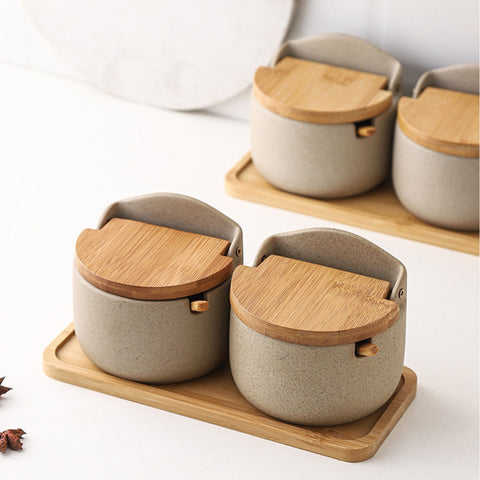 Two spice jars on tray with closed bamboo lids
