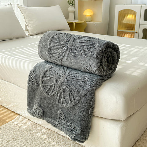 Charcoal gray butterfly throw blanket on bed – modern cozy fleece blanket