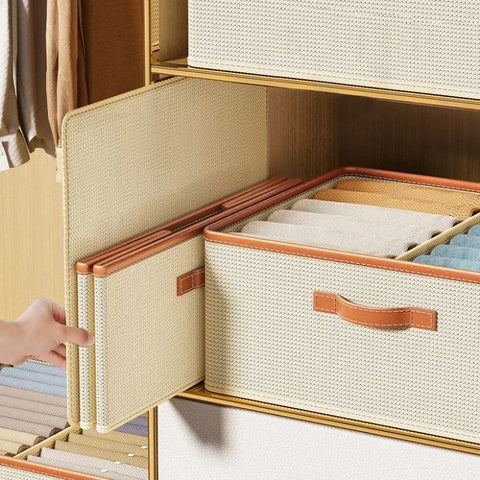 Open storage box showing shirts and clothes in compartments