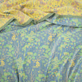 Close-up of triple-layer cotton gauze fabric in leafy botanical print