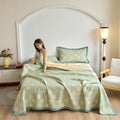Decorative cotton quilt with yellow dots and matching pillow shams