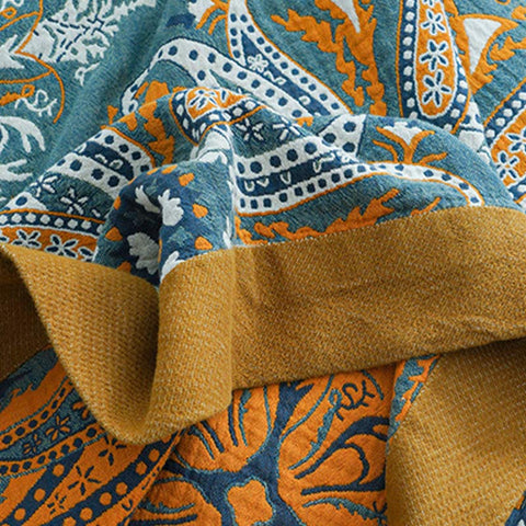 Woven cotton fabric showing intricate stitching and boho motifs