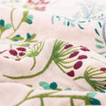 Detailed view of botanical print on breathable cotton gauze blanket fabric

