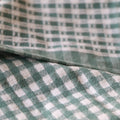 Close-up of green and white checkered fabric cotton kitchen towels set of 3
