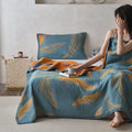Relaxing morning moment with feather patterned cotton gauze quilt
