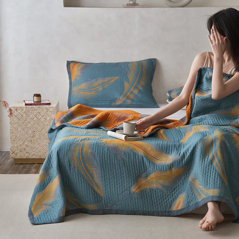 Relaxing morning moment with feather patterned cotton gauze quilt
