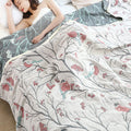 Cozy Tree Bird quilt with red berries and branch print