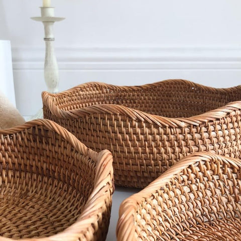 Curved edge rattan baskets styled for fruit and bread storage