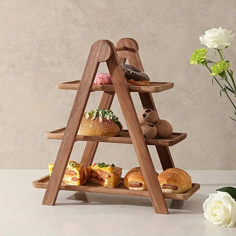 Wooden tiered stand with pastries on a light background