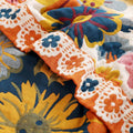 Close-up of Daisy Flower Cotton Blanket edge with intricate stitching and floral design