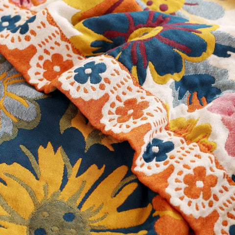 Close-up of Daisy Flower Cotton Blanket edge with intricate stitching and floral design