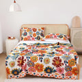 Full spread view of Daisy Flower Cotton Blanket on a bedroom bed with floral pillows
