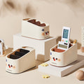 Set of white desk organizers with colorful accents on a neutral background