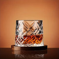 Diamond-cut whiskey glass with rich amber drink