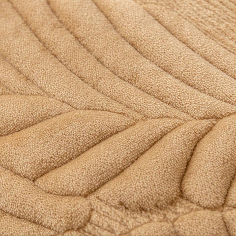 Non-slip backing closeup of plush camel couch protector