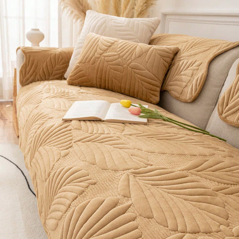 Side view of plush leaf-patterned camel couch cover