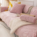 Lotus Pink quilted sofa cover with leaf design on cozy 3-seater