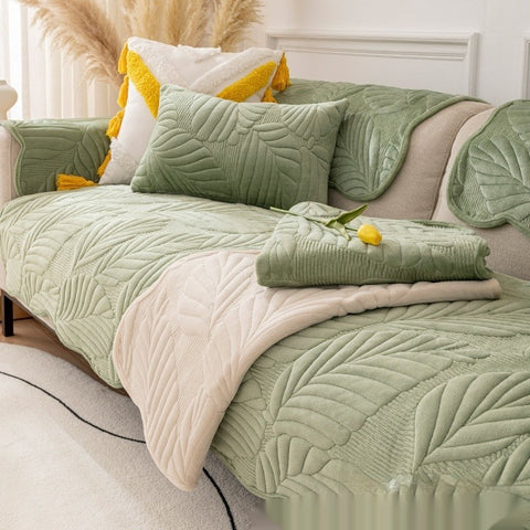 Matcha green plush non-slip sofa cover with pillows on modern couch