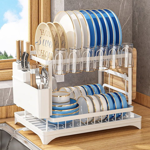 Dish drying rack with blue and white dishes in a kitchen setting