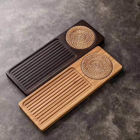 Elegant long bamboo tea tray on dark table