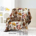 Floral patterned blanket draped over a chair with size information displayed.
