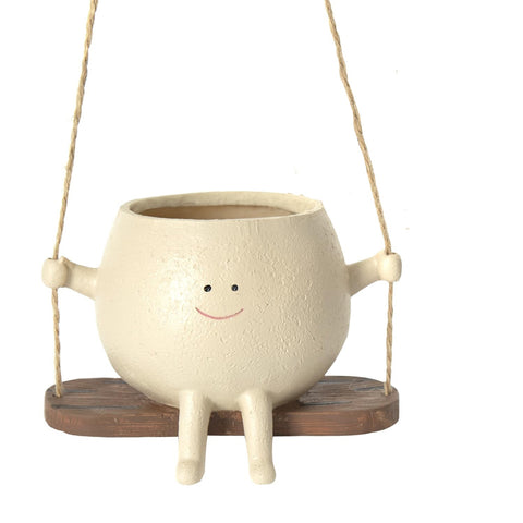 Close-up of empty smiley swing planter with rope