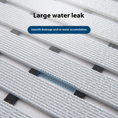 Quick-drain grooves prevent water buildup on bathroom mats