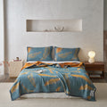Feather quilt used as cozy couch throw with matching pillow