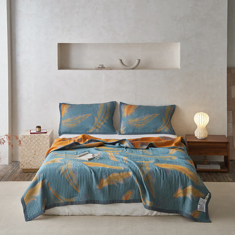 Feather quilt used as cozy couch throw with matching pillow