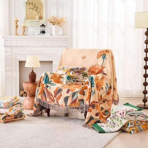 Floral-patterned blanket draped over a chair in a cozy living room.