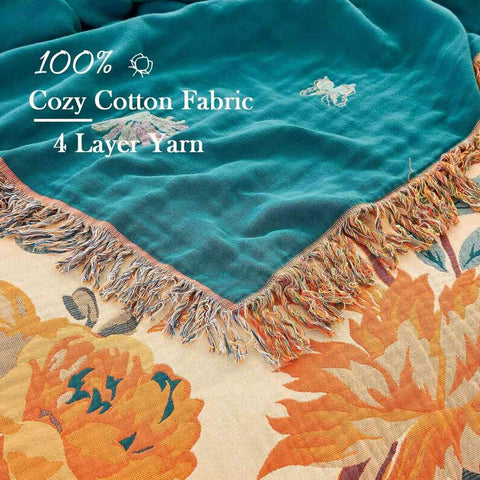Floral-patterned fabric with teal top layer and colorful fringe, featuring text about fabric type.
