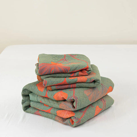 Folded quilt stack showcasing fabric and design