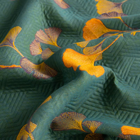  Embroidered botanical details and orange trim on Ginkgo Dreams quilt