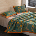  Side view of Ginkgo Dreams quilt with matching pillows in modern bedroom