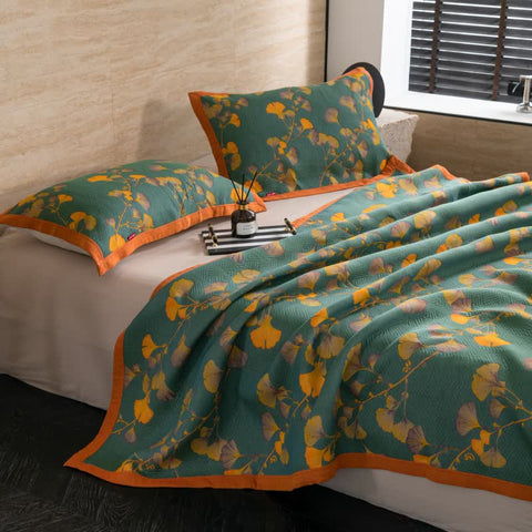  Side view of Ginkgo Dreams quilt with matching pillows in modern bedroom
