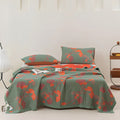 Full bedroom view of ginkgo leaf orange floral blanket with matching pillowcases on bed